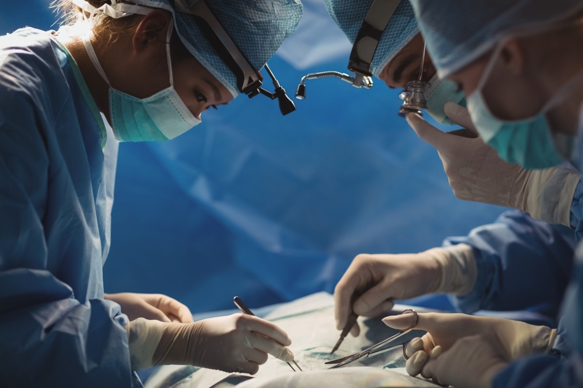 Surgeons performing operation in operation room at the hospital